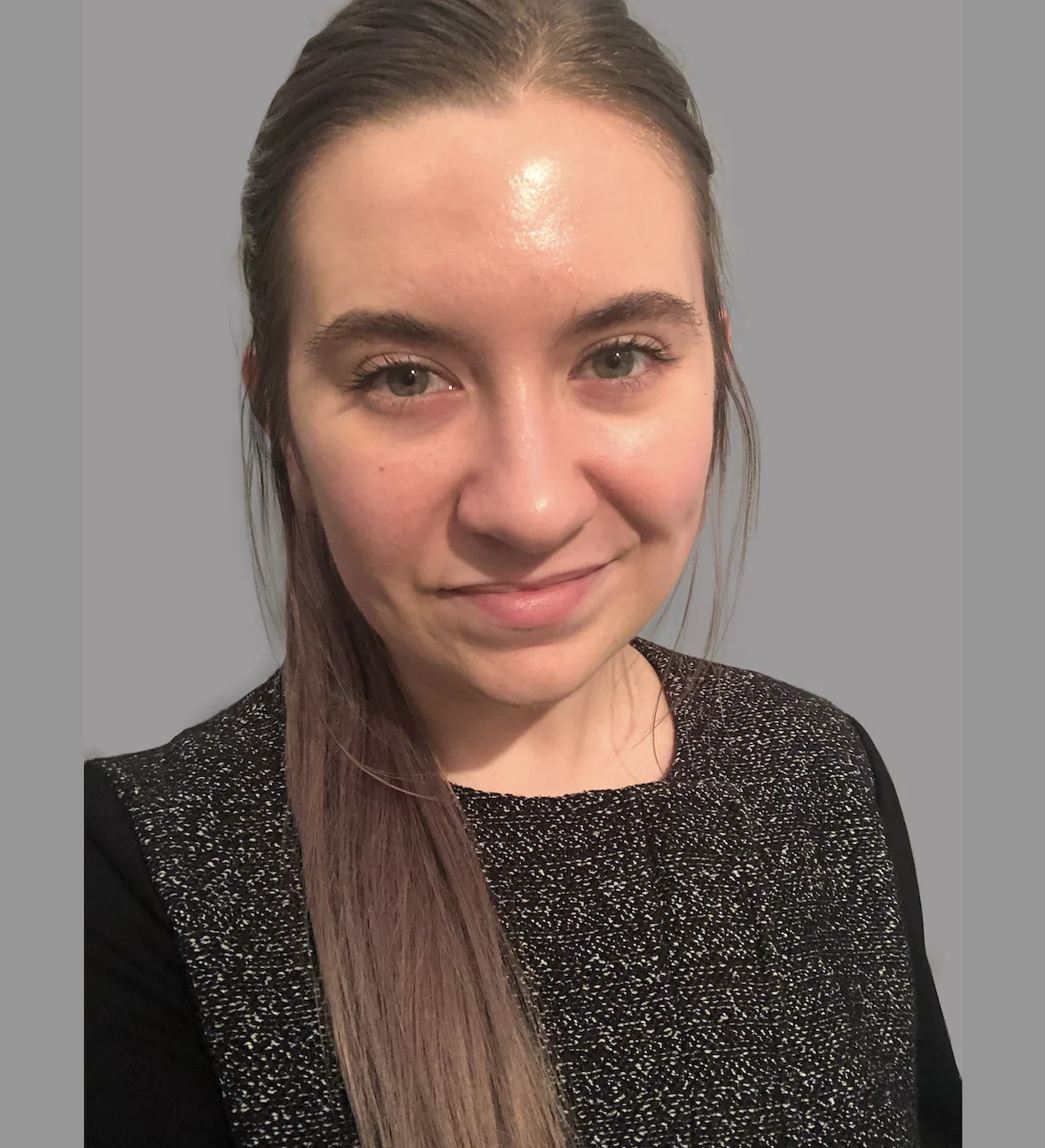 Headshot image of woman wearing a black shirt.