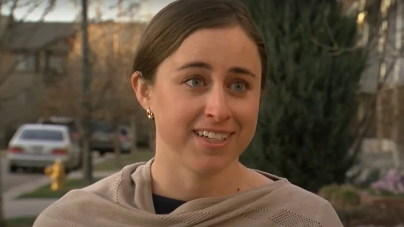 a woman with a scarf around her neck